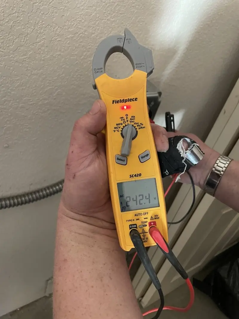 Voltage testing with clamp meter during Ceiling Fan Installation in Olmsted Falls